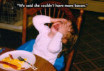 Crying child at the table with her bacon and eggs meal