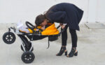 mountain-buggy-swift-kissing baby