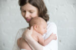 happy mother holding newborn baby