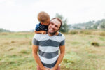Father with son on shoulders