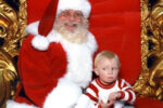 Mum Shares Hilarious Santa Photo of Son Signing on Santa's Lap