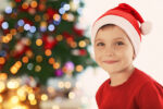 boy wearing santa hat questions about Santa