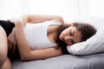 woman showing miscarriage signs and symptoms