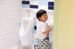 teach boys to pee standing up