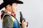 children paying with toy guns