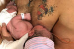dad breastfeeds baby