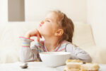 child eating breakfast cereal