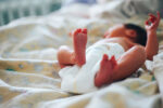 newborn baby in crib - was the baby switched at birth?