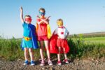 kids dressed as superheroes