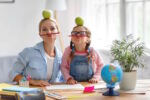 Mum and daughter doing homework and having fun