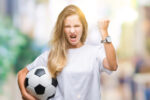Woman-holding-football-with fist-up-angry