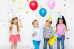 young kids holding balloons and presents, kids party