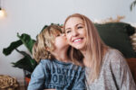boy kissing his mum | mum mood booster