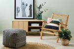 console, furniture, chair, ottoman, rug, plant, wall art, vase