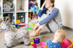 Surviving motherhood | tired mum with baby