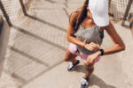 Woman running, using watch to exercise, fitness