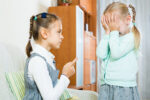 girl pointing finger at her sister | blaming
