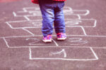 kid playing hopscotch driveway accidents
