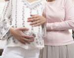 grandmother and mother breastfeeding help duties