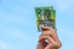 hand holding Australian currency