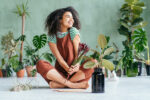 lady surrounded by indoor plants