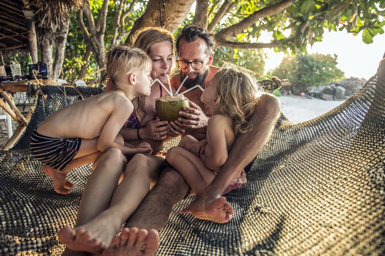 TID Family in Bali Drinking Coconut