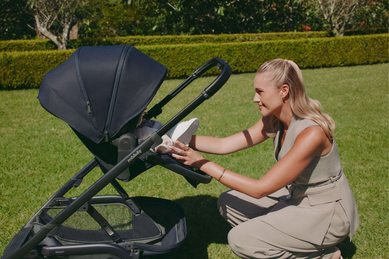 Mother with a baby in the new Redsbaby Nuvo2 pram