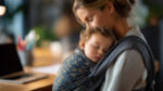 babywearing mother with child in baby carrier