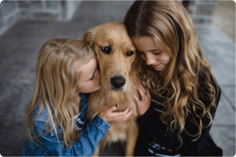 Young girls with pet dog
